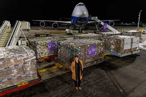 Kristy Carr, chief executive of Bubs Australia poses in front of pallets of Bubs baby formula at Melbourne Airport on June 12, 2022 in Melbourne, Australia. Bubs Australia will export approximately 4.6 millions bottle of instant baby formula to the United States where they are experiencing a shortage, under an agreement between Australia and the Biden Administration.