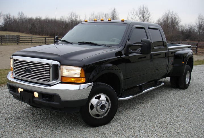 Black pickup truck with a silver grill and running lights above the windshield