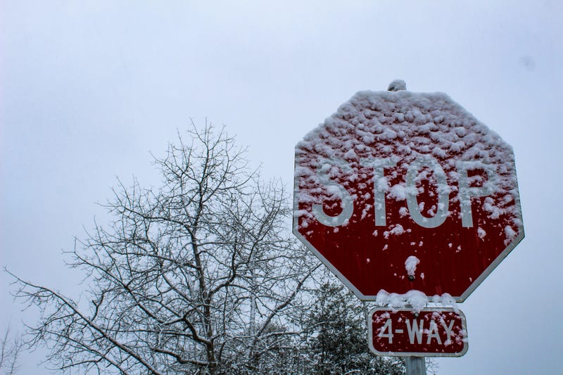 Snow covered stop sign.