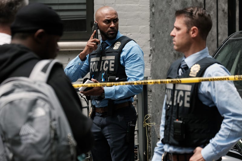 Police gather at the scene of a shooting in Brooklyn that left one person dead on June 16, 2022