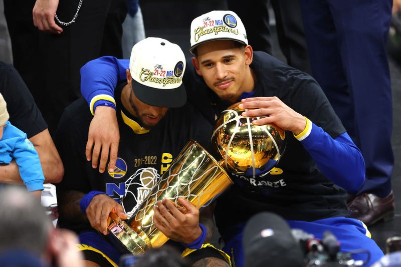 Gary Payton II #0 and Juan Toscano-Anderson #95 of the Golden State Warriors celebrate after defeating the Boston Celtics 103-90 in Game Six of the 2022 NBA Finals at TD Garden on June 16, 2022 in Boston, Massachusetts.