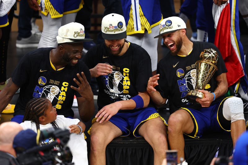 Draymond Green #23, Klay Thompson #11 and Stephen Curry #30 of the Golden State Warriors laugh together after defeating the Boston Celtics 103-90 in Game Six of the 2022 NBA Finals at TD Garden on June 16, 2022 in Boston, Massachusetts. 