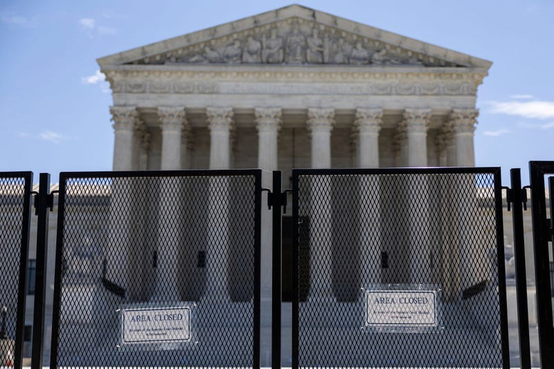 WASHINGTON, DC - JUNE 20: Temporary security fencing surrounds the U.S. Supreme Court Building on June 20, 2022 in Washington, DC. This week the court will release more opinions for cases including decisions on abortion rights, guns, religion and climate change. 