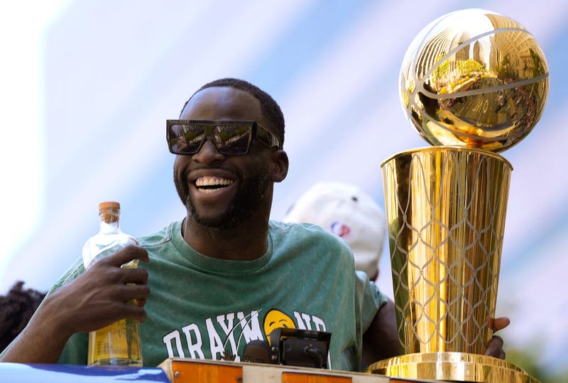 Draymond Green #23 of the Golden State Warriors celebrates with the NBA Championship Trophy during the Golden State Warriors Victory Parade on June 20, 2022 in San Francisco, California. 