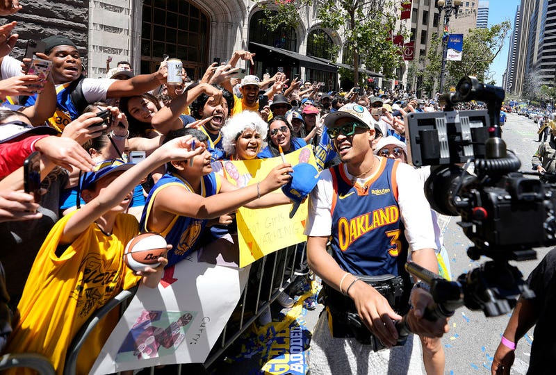 Jordan Poole #3 of the Golden State Warriors celebrates with fans during the Golden State Warriors Victory Parade on June 20, 2022 in San Francisco, California. 