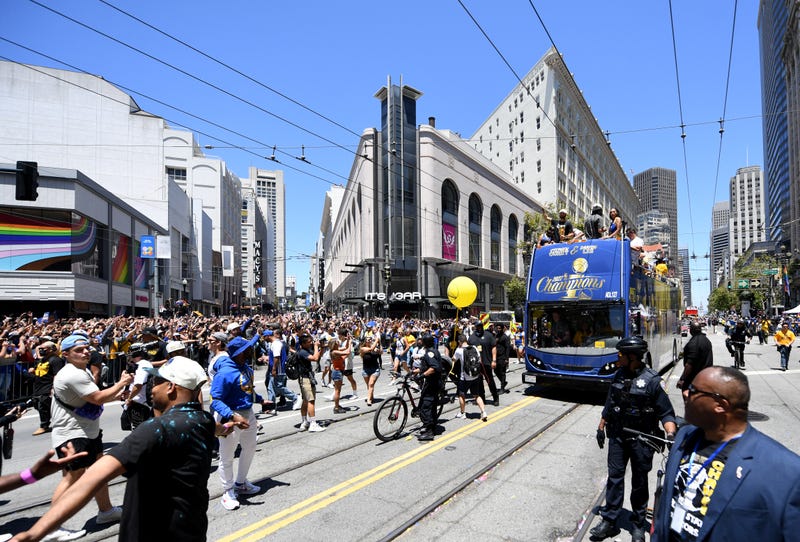 Stephen Curry #30 of the Golden State Warriors, his wife Ayesha, and daughter Riley celebrate with his NBA Finals Most Valuable Player Award during the Victory Parade on June 20, 2022 in San Francisco, California.