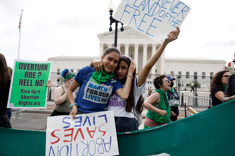 Pro-life activists react to the Dobbs v Jackson Women’s Health Organization ruling which overturns the landmark abortion Roe v. Wade case in front of the U.S. Supreme Court on June 24, 2022 in Washington, DC
