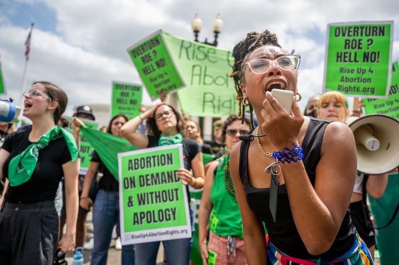 Abortion rights demonstrator Elizabeth White leads a chant in response to the Dobbs v Jackson Women's Health Organization ruling in front of the U.S. Supreme Court on June 24, 2022 in Washington, DC
