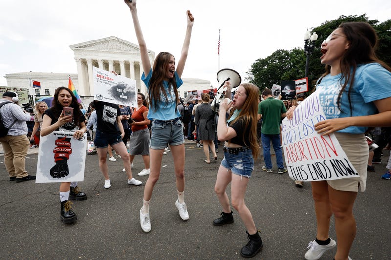 Anti-abortion right activists react to the Dobbs v Jackson Women's Health Organization ruling in front of the U.S. Supreme Court on June 24, 2022 in Washington, DC
