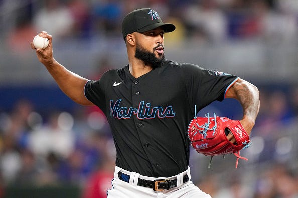 Sandy Alcantara models the black alternate tops of the Marlins.