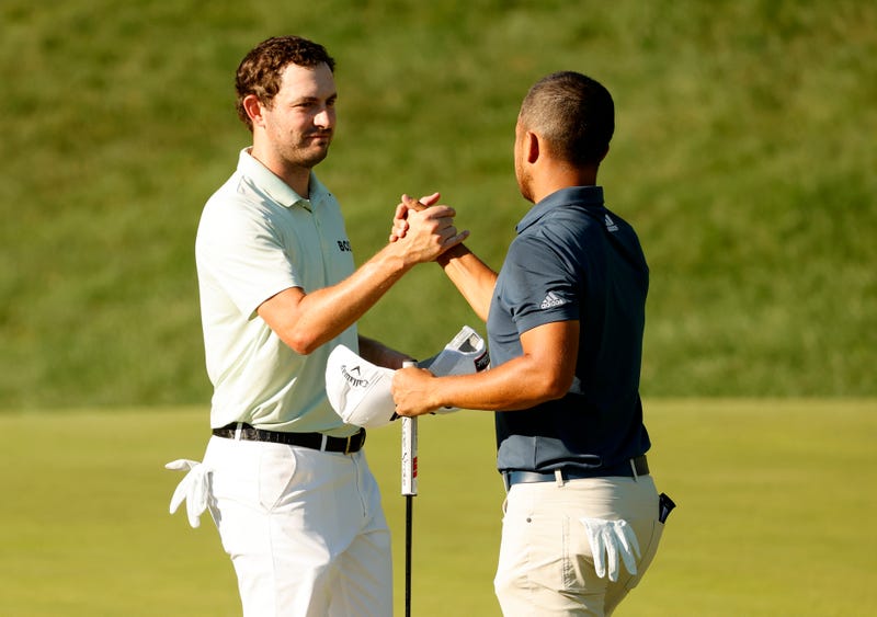Xander Schauffele (R) and Patrick Cantlay finish their third round of the Travelers Championship in Cromwell, 6/25/22