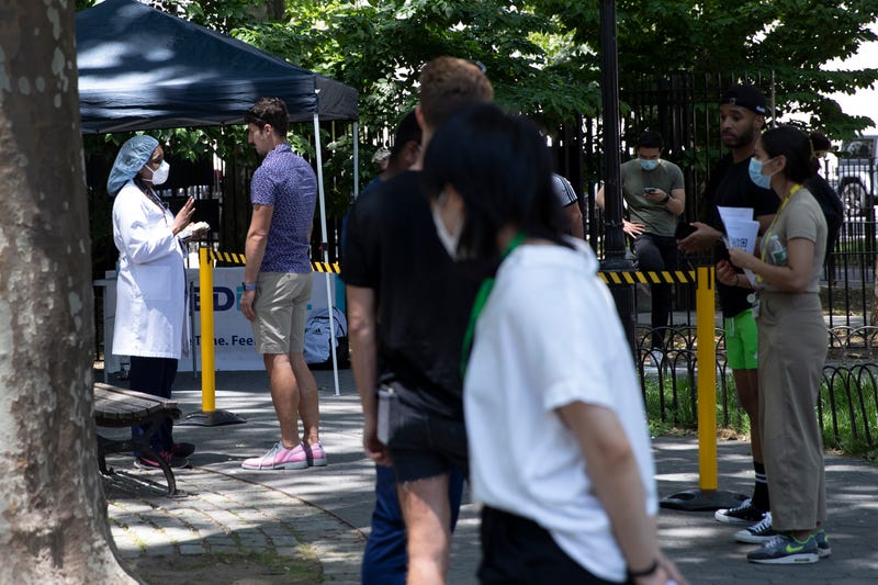 People consult about monkeypox vaccination at a temporary clinic on June 24, 2022 in New York City. 
