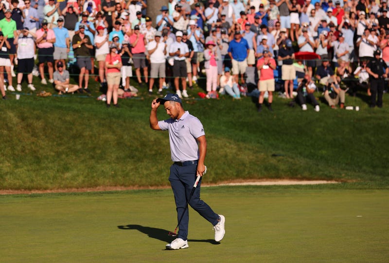 Xander Schauffele reacts after putting in to win on the 18th green during the final round of Travelers Championship in Cromwell, 6/26/22