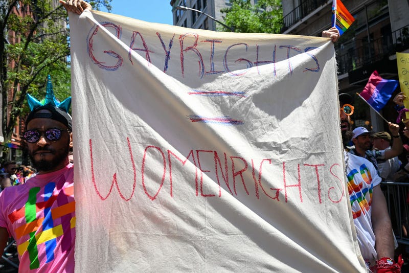 A person holds a "gay rights = human rights" sign in the New York City Pride Parade on June 26, 2022, in New York City.