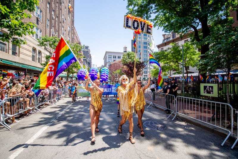 People in pride colors attend and march in front of the Stonewall Inn during the 2022 New York City Pride March on June 26, 2022 in New York City.