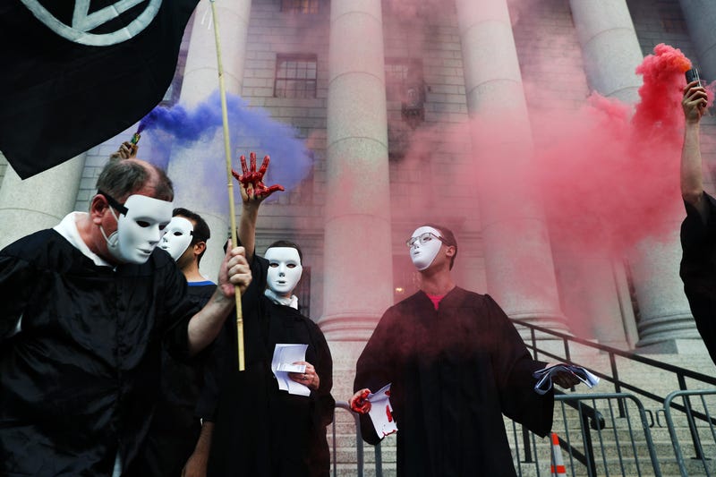 Climate activists, including members of Extinction Rebellion, participate in a demonstration in front of the Thurgood Marshall US Courthouse against a recent Supreme Court ruling on June 30, 2022 in New York City. In a ruling that sent anger through the environmental community, the Supreme Court curbed the Environmental Protection Agency's ability to broadly regulate carbon emissions from existing power plants. The decision will further limit the Biden administration’s authority to restrict the carbon pollution that is contributing to global warming.