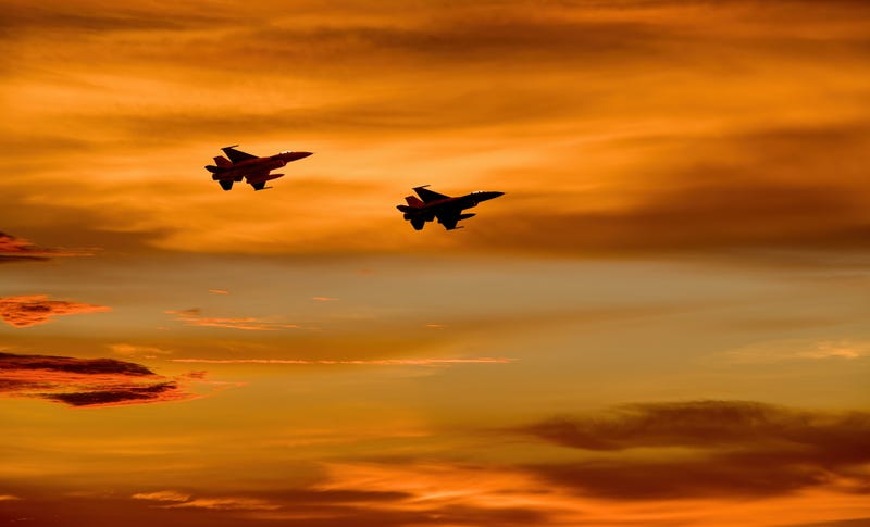 Two United States fighter jets in the sky. 