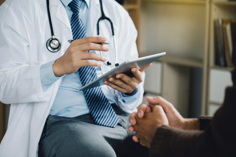Doctor talking with patient