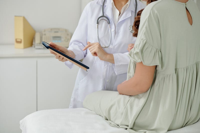 Woman talking with OBGYN