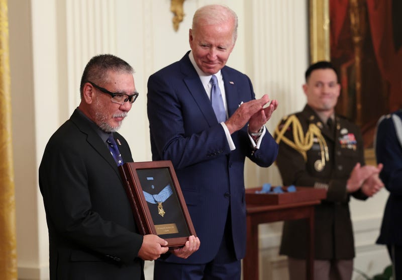 John Kaneshiro accepts the Medal of Honor for his late father, Army Staff Sergeant Edward N. Kaneshiro, as U.S. President Joe Biden posthumously awards it, during an event in the East Room of the White House July 5, 2022 in Washington, D.C.