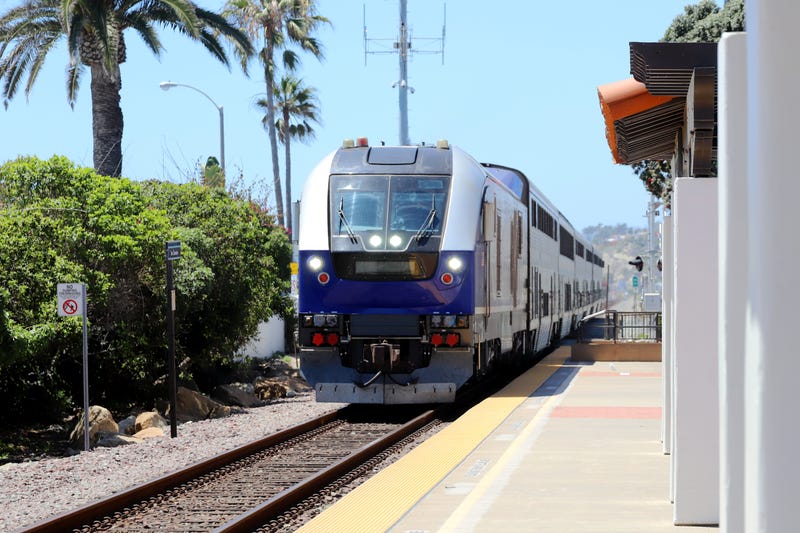 Amtrak Pacific Surfliner Train passing San Clemente Train Station.