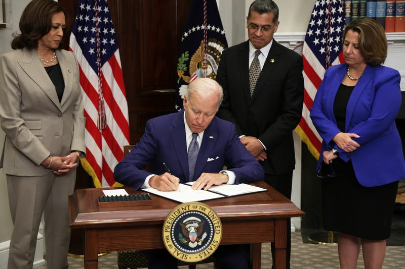 U.S. President Joe Biden signs an executive order on access to reproductive health care services as (L-R) Vice President Kamala Harris, Secretary of Health and Human Services Xavier Becerra, and Deputy Attorney General Lisa Monaco look on during an event at the Roosevelt Room of the White House on July 8, 2022 in Washington, D.C.