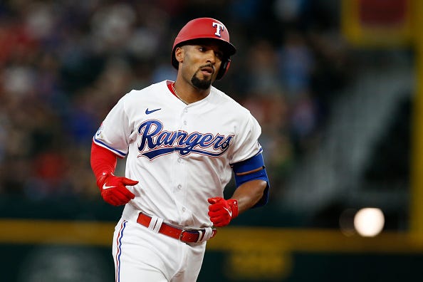 Marcus Semien models one of the current uniforms of the Rangers.