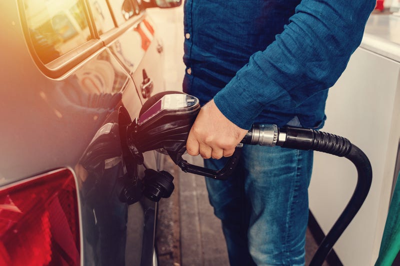 Person pumping gas