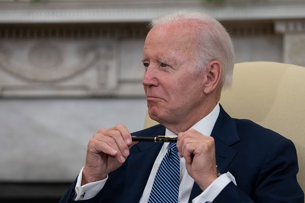U.S. President Joe Biden listens to Mexican President Andres Manuel Lopez Obrador as they talk to journalists in the Oval Office at the White House on July 12, 2022 in Washington, DC.