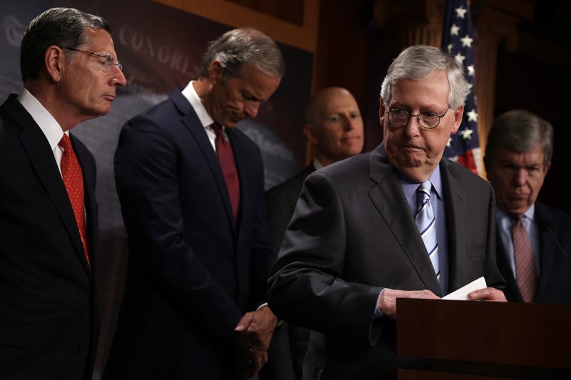 U.S. Senate Minority Leader Sen. Mitch McConnell (R-KY) speaks as (L-R) Sen. John Barrasso (R-WY), Senate Minority Whip Sen. John Thune (R-SD), Sen. Rick Scott (R-FL), and Sen. Roy Blunt (R-MO) listen during a news briefing after a weekly Senate Republican policy luncheon at the U.S. Capitol on July 12, 2022 in Washington, D.C.