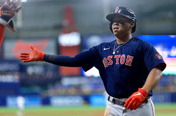 Rafael Devers models the road alternate uniforms of the Red Sox.