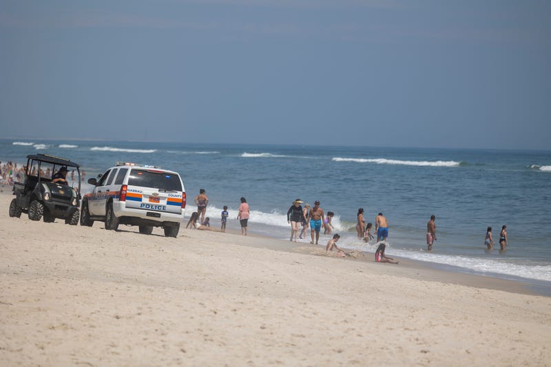 Town of Oyster Bay Constable with public safety and the Nassau County Police keep an eye on the waters off Tobay Beach for sharks on July 14, 2022 in Massapequa, New York.