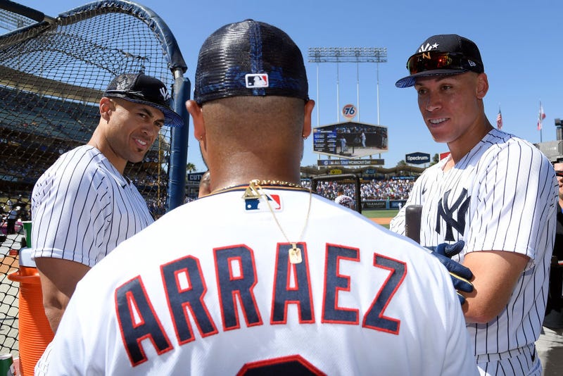 American League All-Stars Giancarlo Stanton #27 (L) and Aaron Judge #99 of the New York Yankees (R) talk with Luis Arraez #2 of the Minnesota Twins during the 2022 Gatorade All-Star Workout Day at Dodger Stadium on July 18, 2022 in Los Angeles, California.