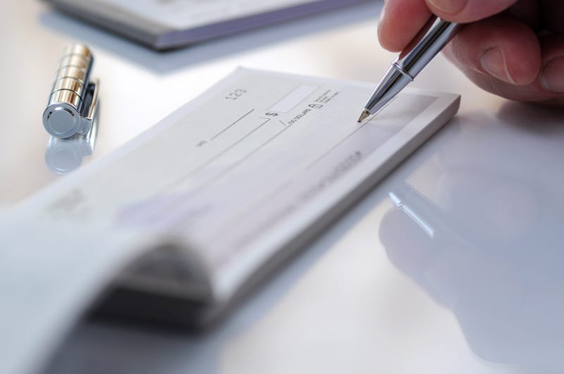 Stock photo of person writing a check