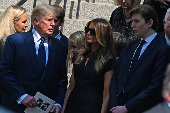 Former President Donald J. Trump, Melania Trump and Barron Trump exit the funeral of Ivana Trump at St. Vincent Ferrer Roman Catholic Church July 20, 2022 in New York City.