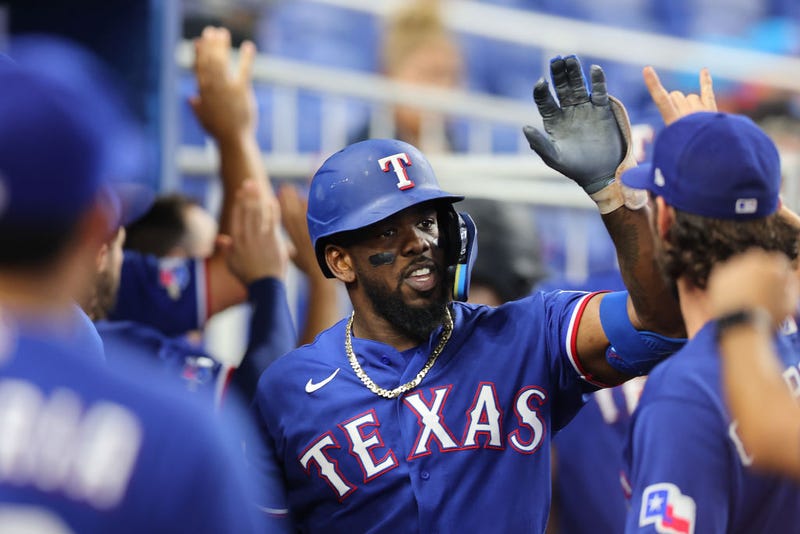 dolis Garcia #53 of the Texas Rangers celebrates with teammates after hitting a two-run home run against the Miami Marlins during the fifth inning at loanDepot park on July 21, 2022 in Miami, Florida. 