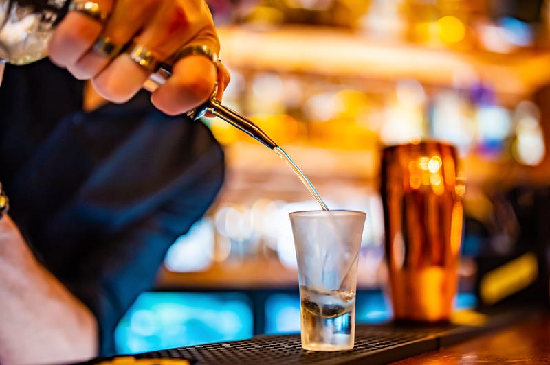 bartender pouring shot