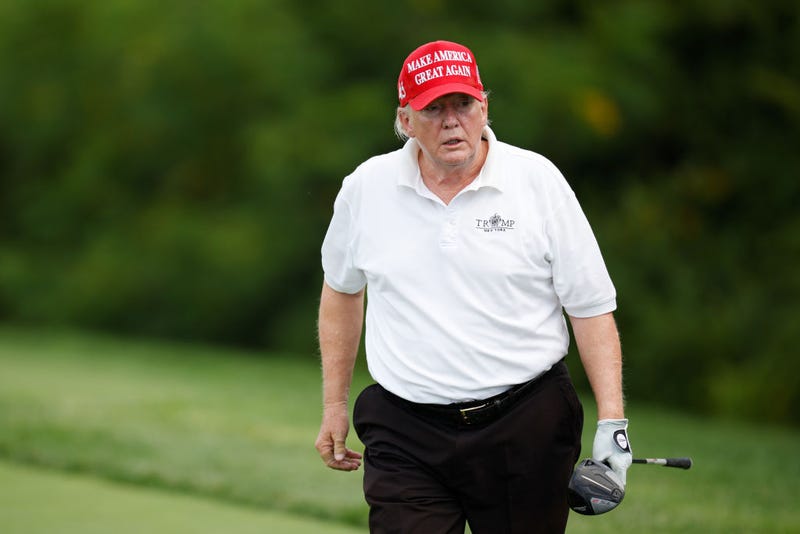 Former U.S. President Donald Trump reacts after his shot from the second tee during the pro-am prior to the LIV Golf Invitational - Bedminster at Trump National Golf Club Bedminster on July 28, 2022 in Bedminster, New Jersey.
