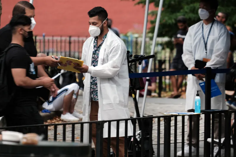 Healthcare workers with New York City Department of Health and Mental Hygiene work at intake tents where individuals are registered to receive the monkeypox vaccine on July 29, 2022 in New York City. The World Health Organization has now declared that the monkeypox outbreak, which continues to grow globally, is a global emergency. 