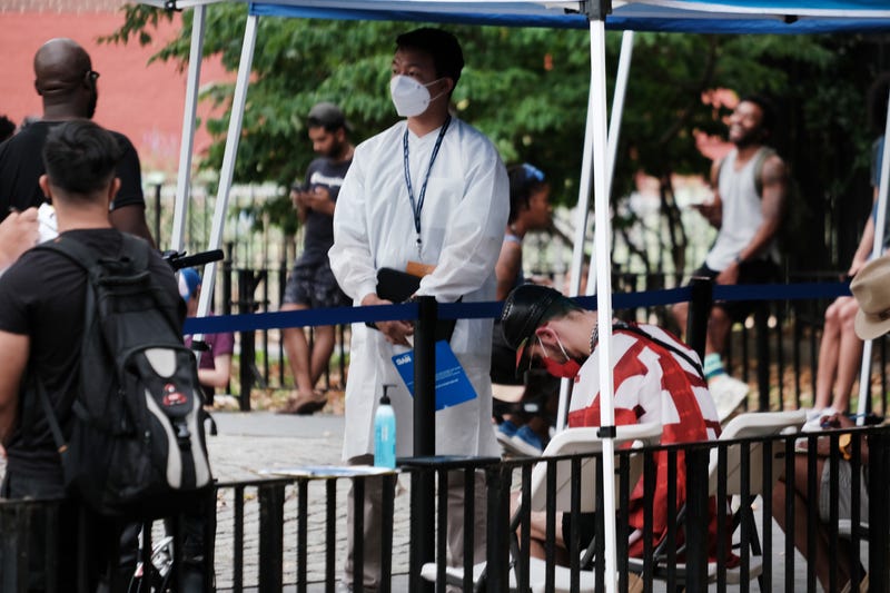 Healthcare workers with New York City Department of Health and Mental Hygiene work at intake tents where individuals are registered to receive the monkeypox vaccine on July 29, 2022 in New York City