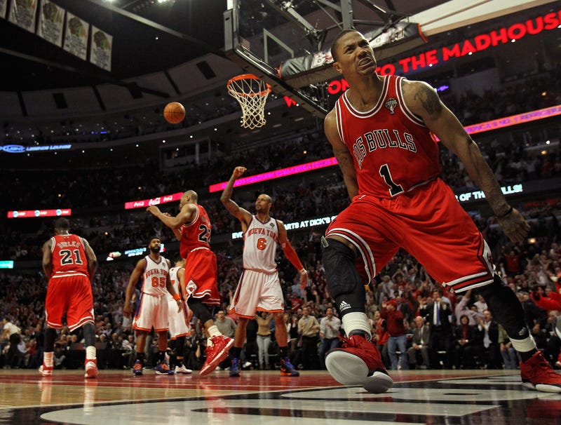 Derrick Rose, of the Chicago Bulls, lets out a scream after dunking the ball against the New York Knicks at the United Center on March 12, 2012, in Chicago.