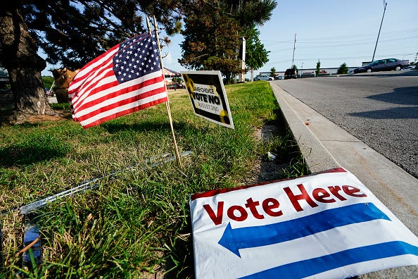 vote here sign on the ground