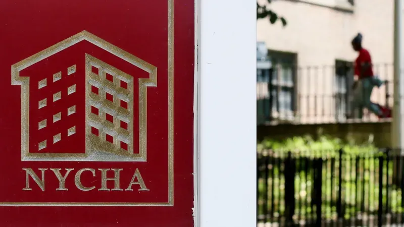 A NYCHA sign is displayed at a housing development in the city. 