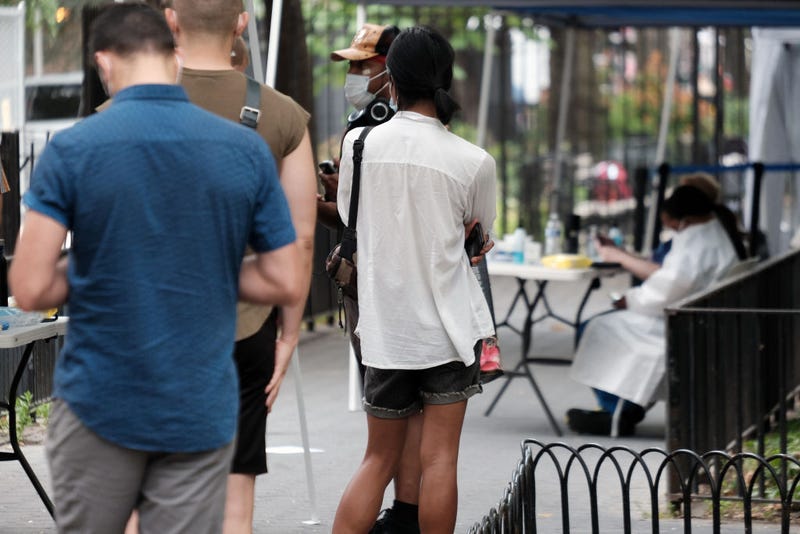 People line up to speak with healthcare workers with New York City Department of Health and Mental Hygiene at intake tents where individuals are registered to receive the monkeypox vaccine on August 5, 2022 in New York City. 