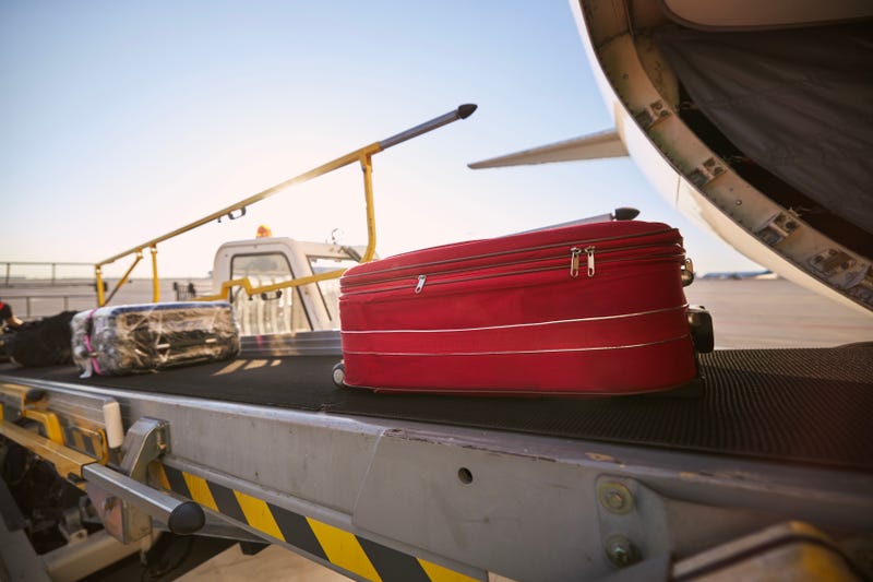 Luggage loaded off of airplane