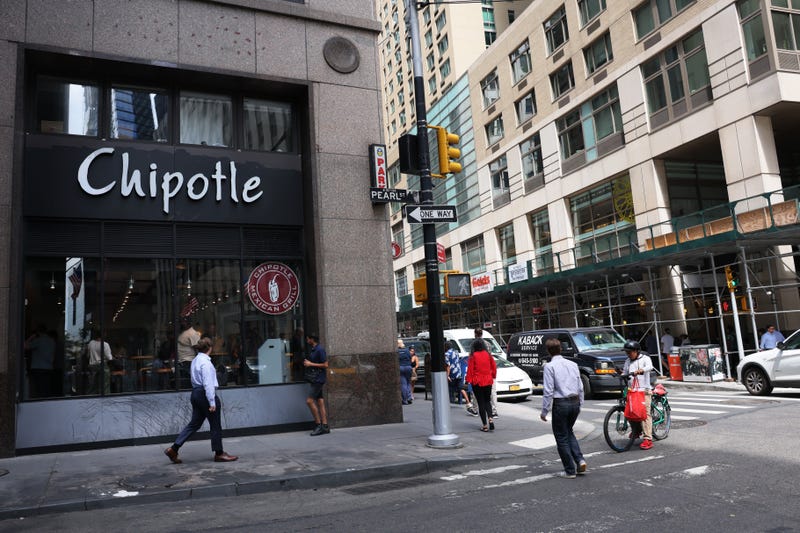 People walk past a Chipotle store on August 10, 2022 in New York City.