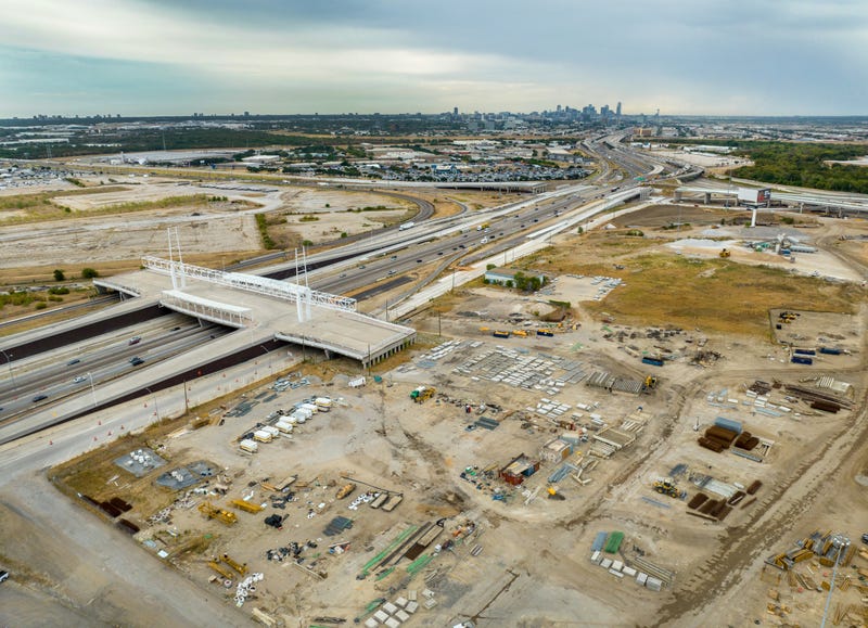 As seen from an aerial view, traffic passes the Irving Interchange infrastructure project at the site of the former Dallas Cowboys Stadium (R), on August 9, 2022 in Irving, Texas.