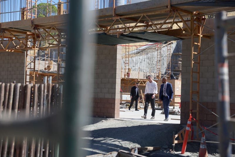 California Gov. Gavin Newsom (L) walks with Antioch Mayor Lamar Thorpe (R) as they tour a desalination plant that is under construction at the Antioch Water Treatment Plant on August 11, 2022 in Antioch, California.