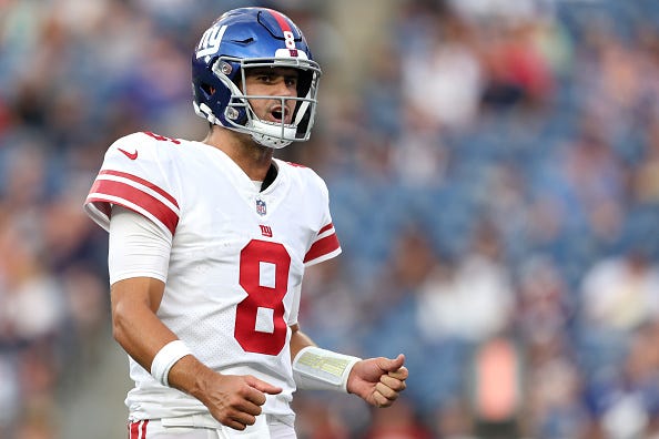 Daniel Jones models the Giants white uniform tops. 