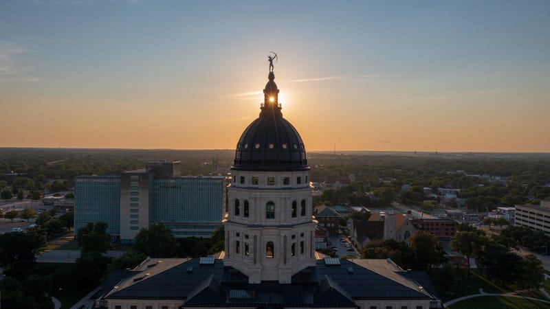 Drone perspective of the Kansas state capitol building at sunset in Topeka, KS